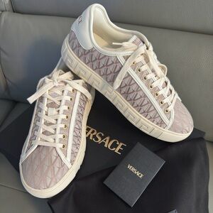 Versace 
Women's Cream and Pink Geometric Sneakers.